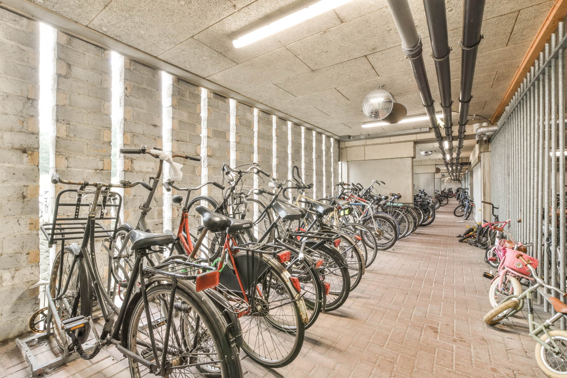 A shared bike storage room in an apartment block, where bikes still need to be locked