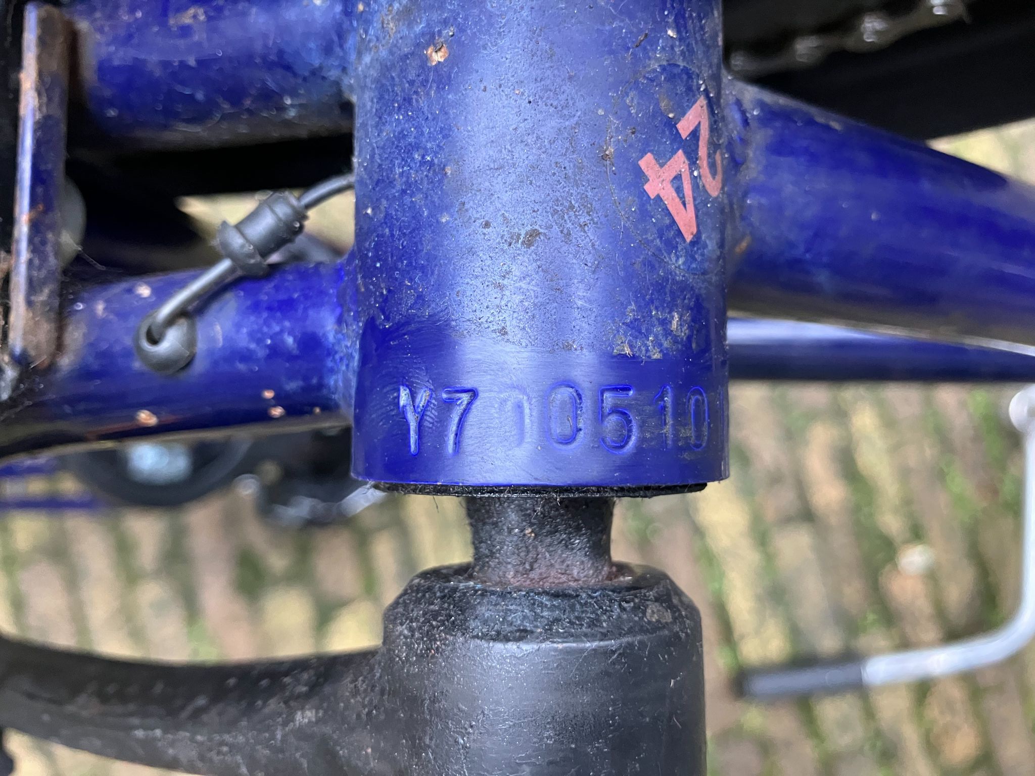 A frame number stamped under the bottom bracket, the number to check on a used bike