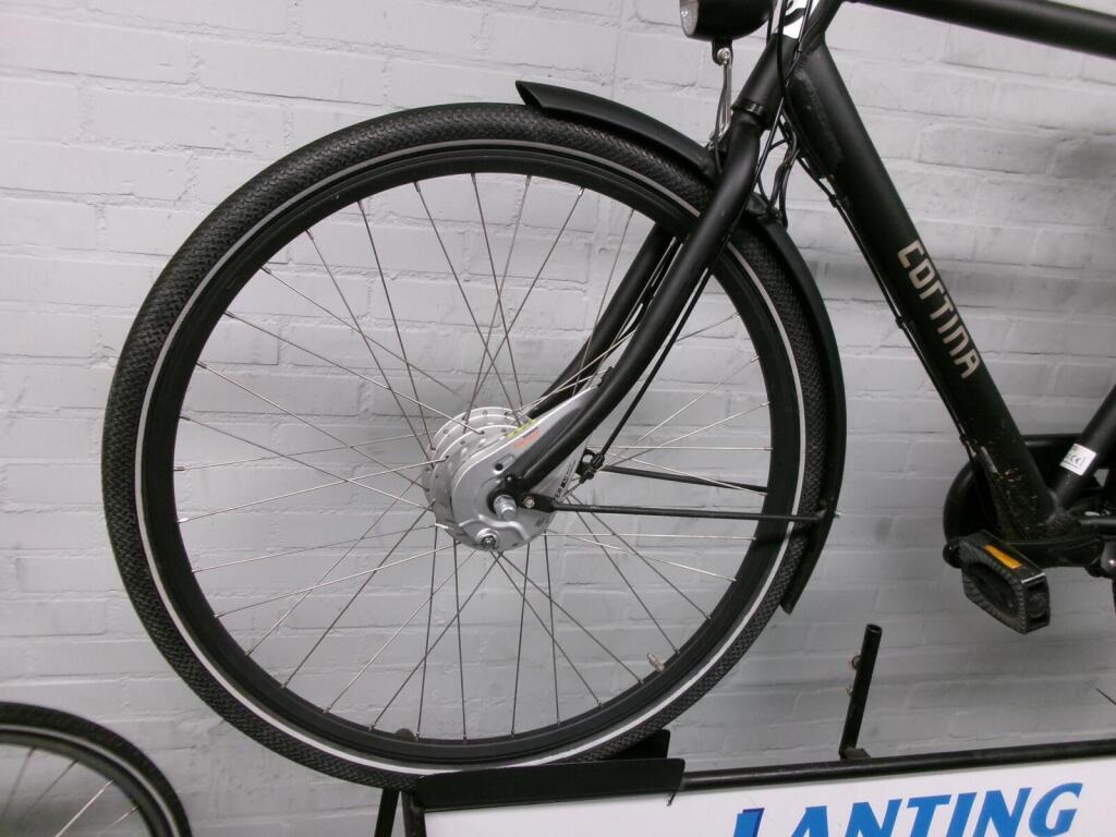 The front wheel of a used electric Cortina U1 with the motor in the front hub