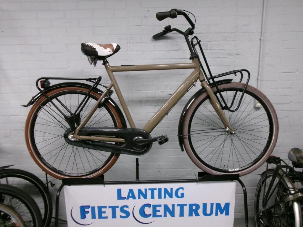 A used Cortina HPV transport bike with a front carrier