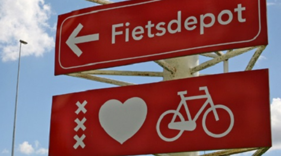 Red bicycle signpost