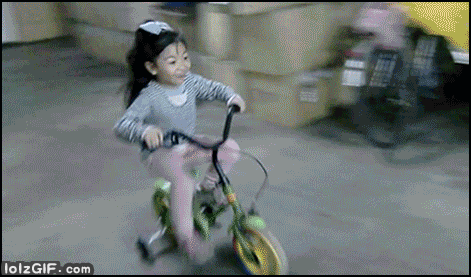 Young lady parking kids bike like a pro