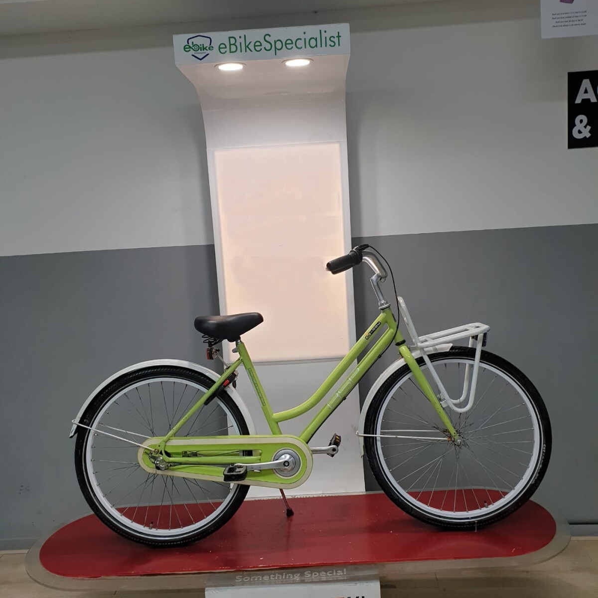 Lime green city bike under lights